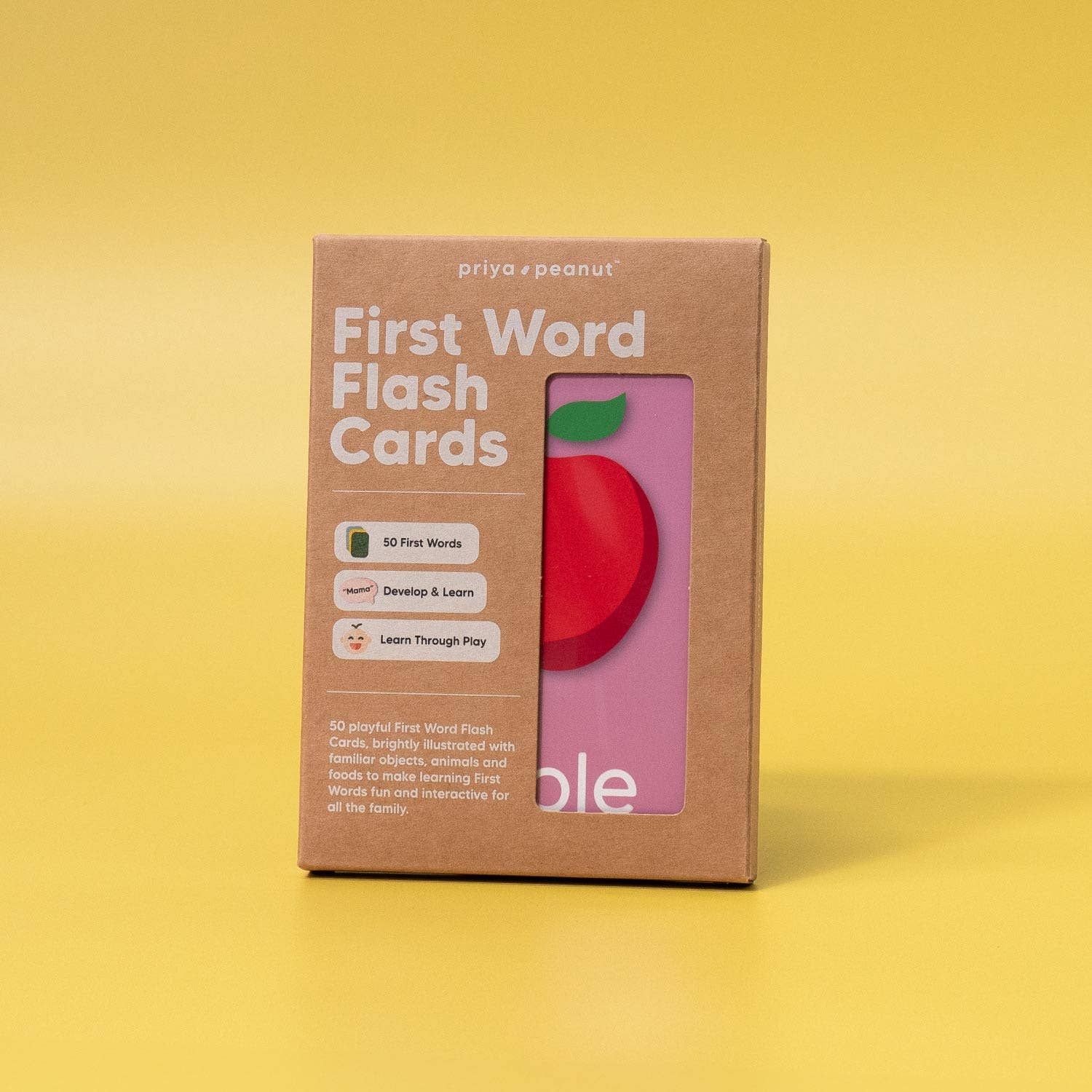 A brown Priya & Peanut First Word Flash Cards box stands on a yellow background. Featuring 50 first words for toddlers, the box’s window reveals an apple card—perfect for learning, play, and speech development.
