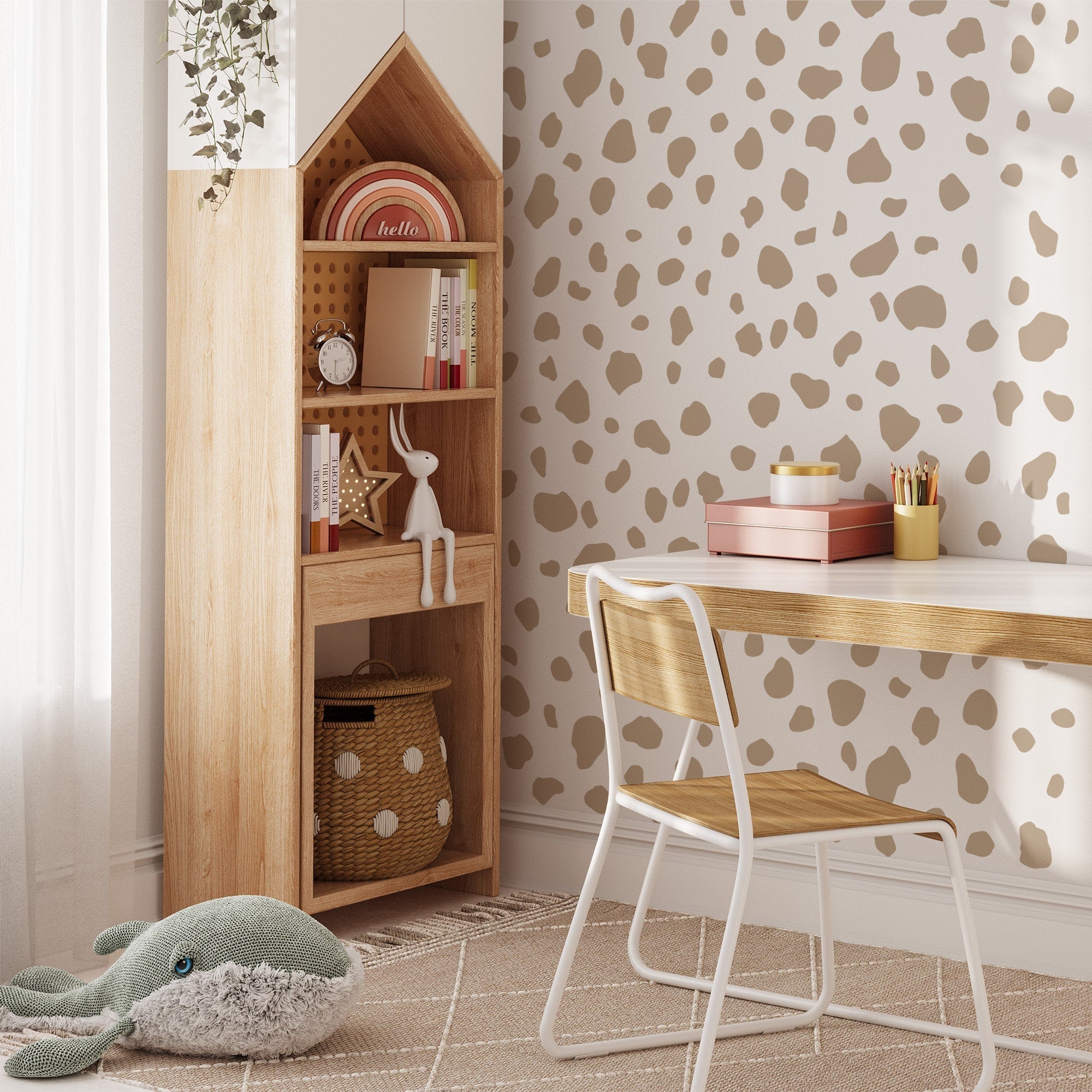 A cozy childrens room features a wooden desk and chair, a house-shaped tall shelf, and a plush whale toy on the carpet. My Stores Dalmatian Spot Stickers in brown and beige add playful wall décor, while soft lighting creates warmth.
