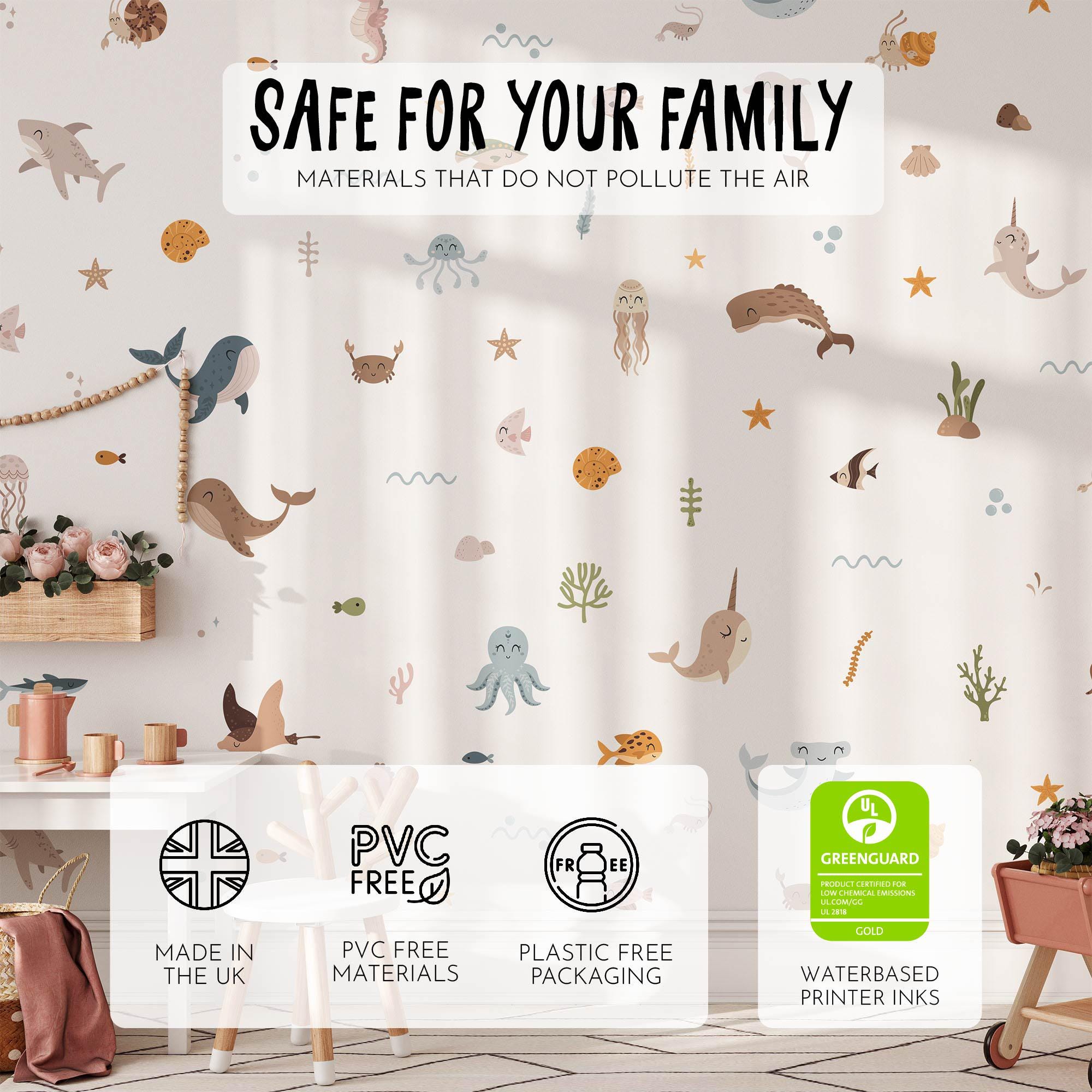 A childrens room decorated with My Stores Ocean Animals Stickers, featuring whales, octopuses, and fish. Wooden furniture, pink accents, and plants complete the eco-friendly space, with removable sea animal decals made from non-polluting materials.