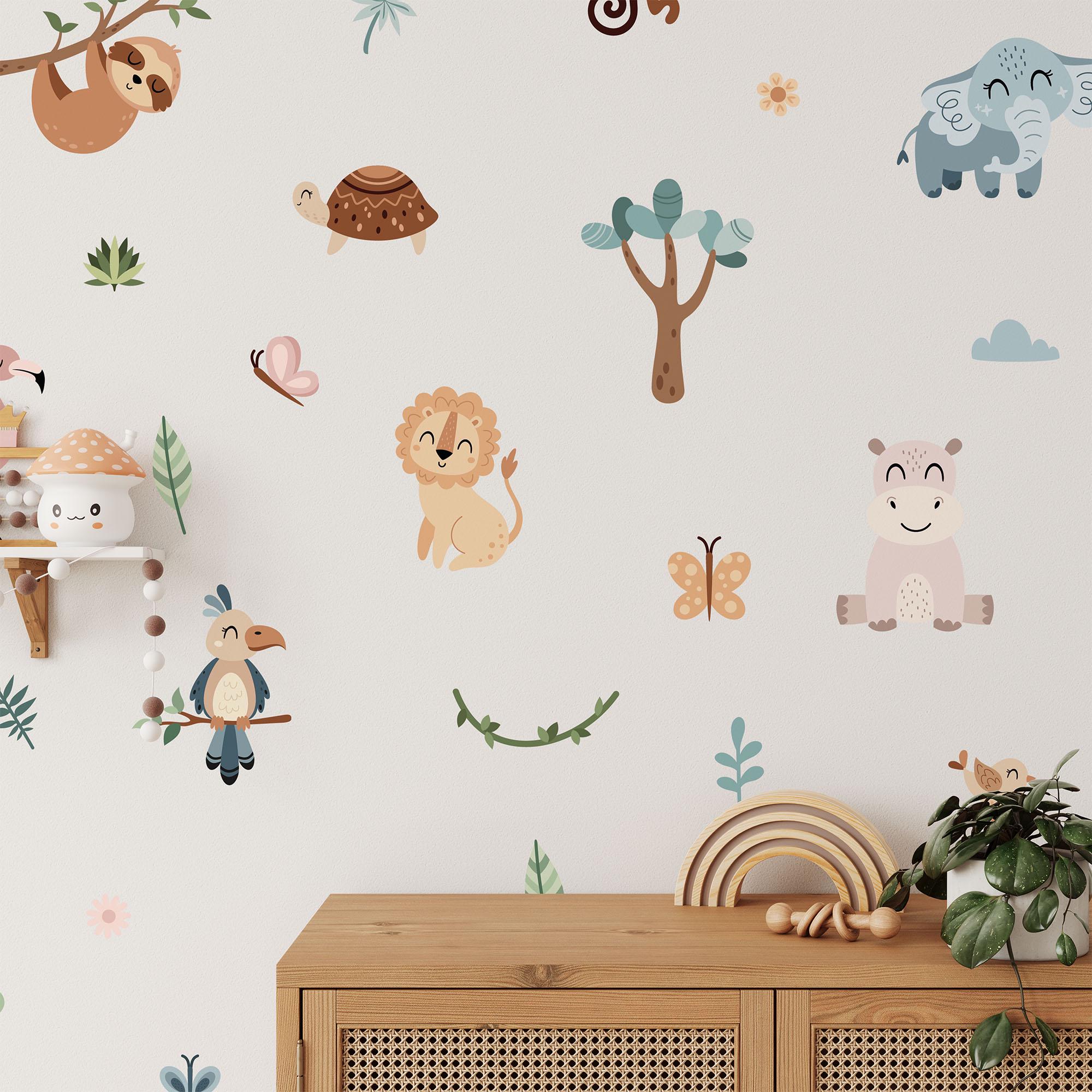 A whimsical nursery features My Stores Jungle Animal Wall Stickers, showcasing a lion, elephant, hippo, bird, turtle, and tree accented by butterflies and leaves. A wooden shelf with a mushroom decor rests on the left.