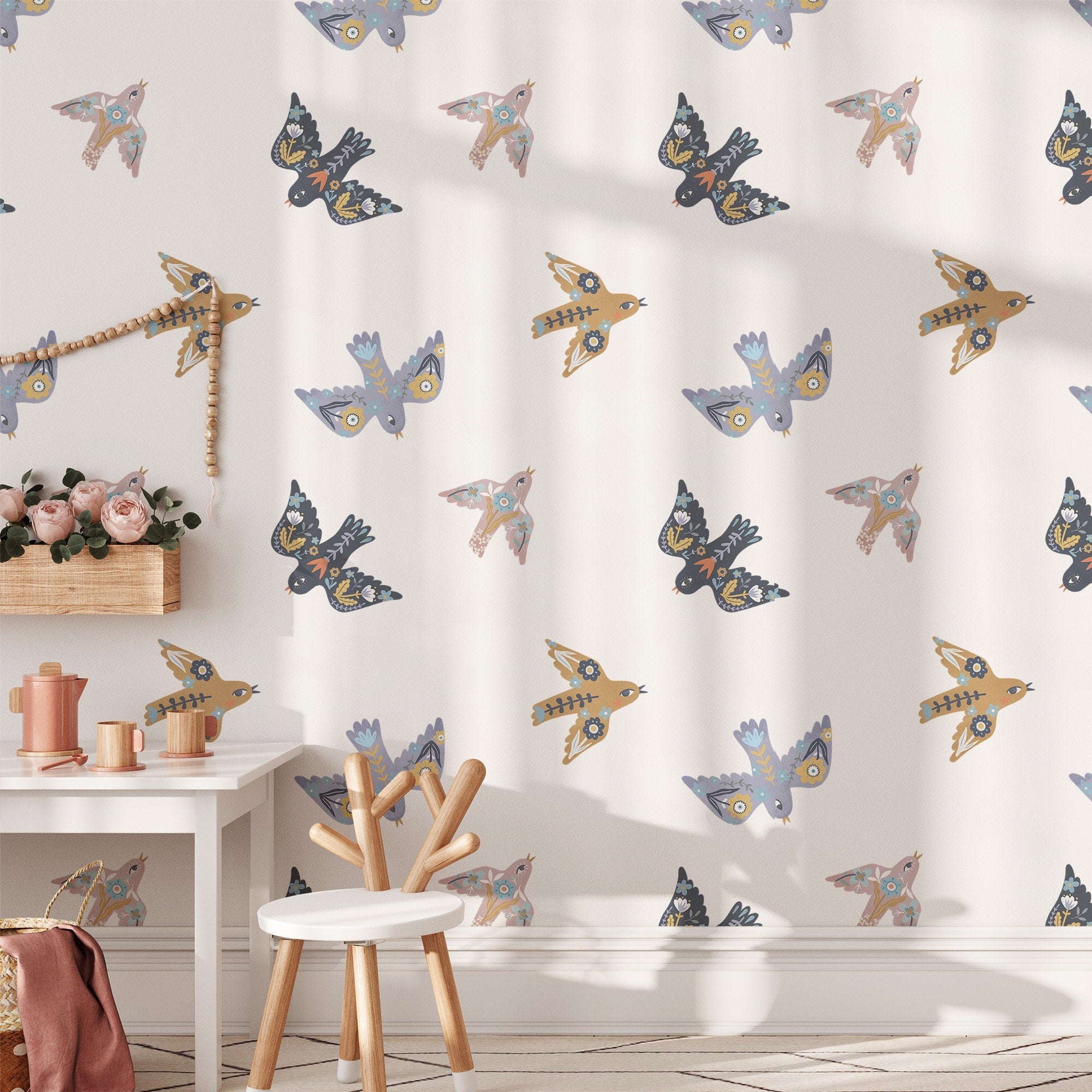 A room adorned with My Stores Summer Mood Wall Stickers, featuring vibrant bird patterns, exudes a lively summer vibe. A white chair and small table with decor add charm as sunlight dances across the enchanting scene.