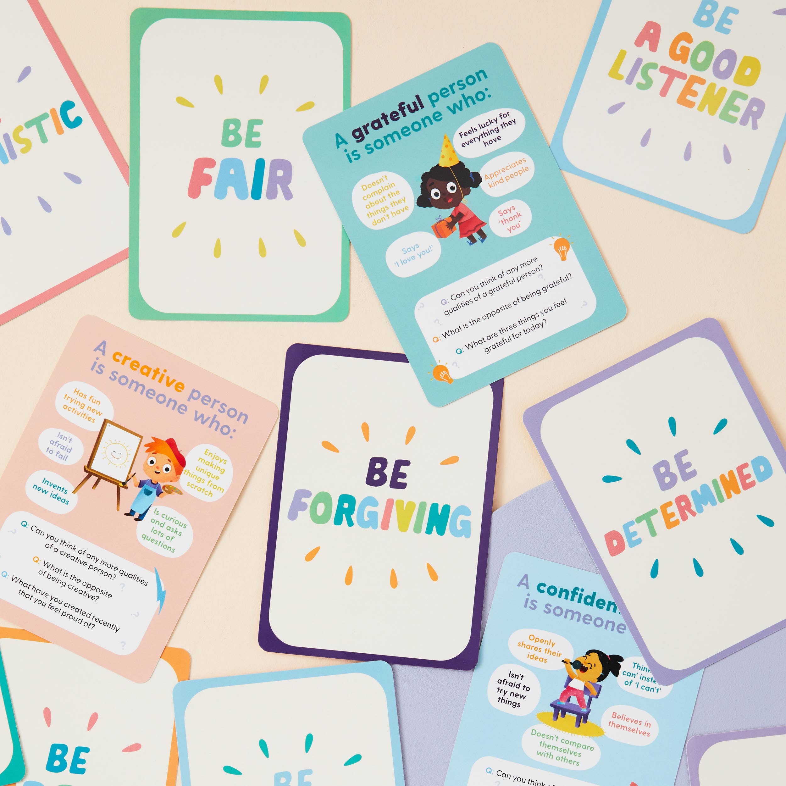 The Character Matters Flashcards for Kids by Mindful Champs shows colorful cards with positive traits like Be Fair and Be a Good Listener, illustrated children, and prompts to inspire character growth in children.