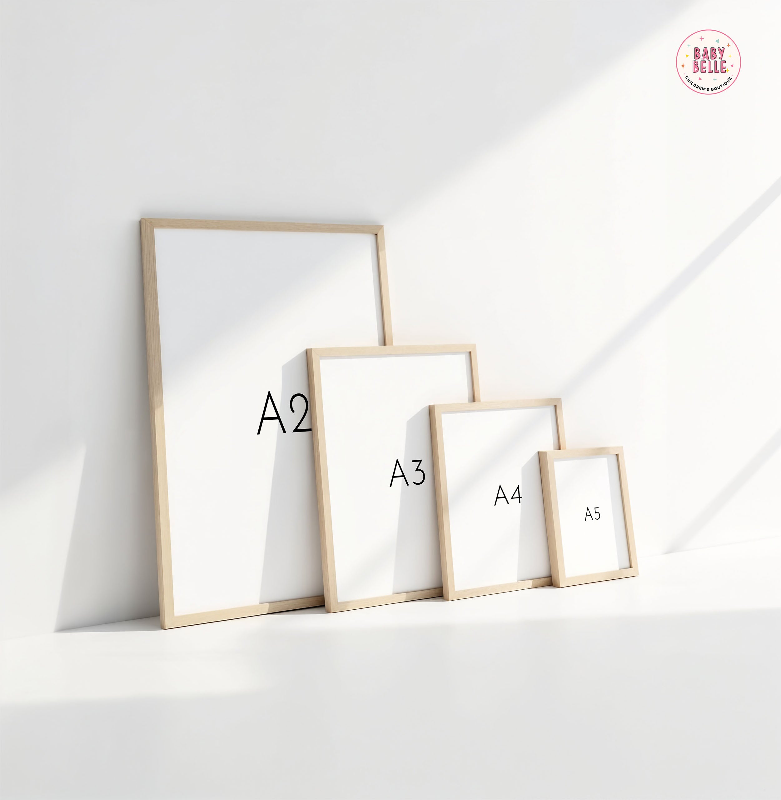 Displaying against a white wall, four Space Alphabet Nursery Print frames by My Store labeled A2, A3, A4, and A5 create a dance of light and shadow reminiscent of woodland animals in an artful nursery arrangement.