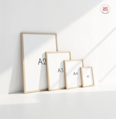 Displaying against a white wall, four Space Alphabet Nursery Print frames by My Store labeled A2, A3, A4, and A5 create a dance of light and shadow reminiscent of woodland animals in an artful nursery arrangement.