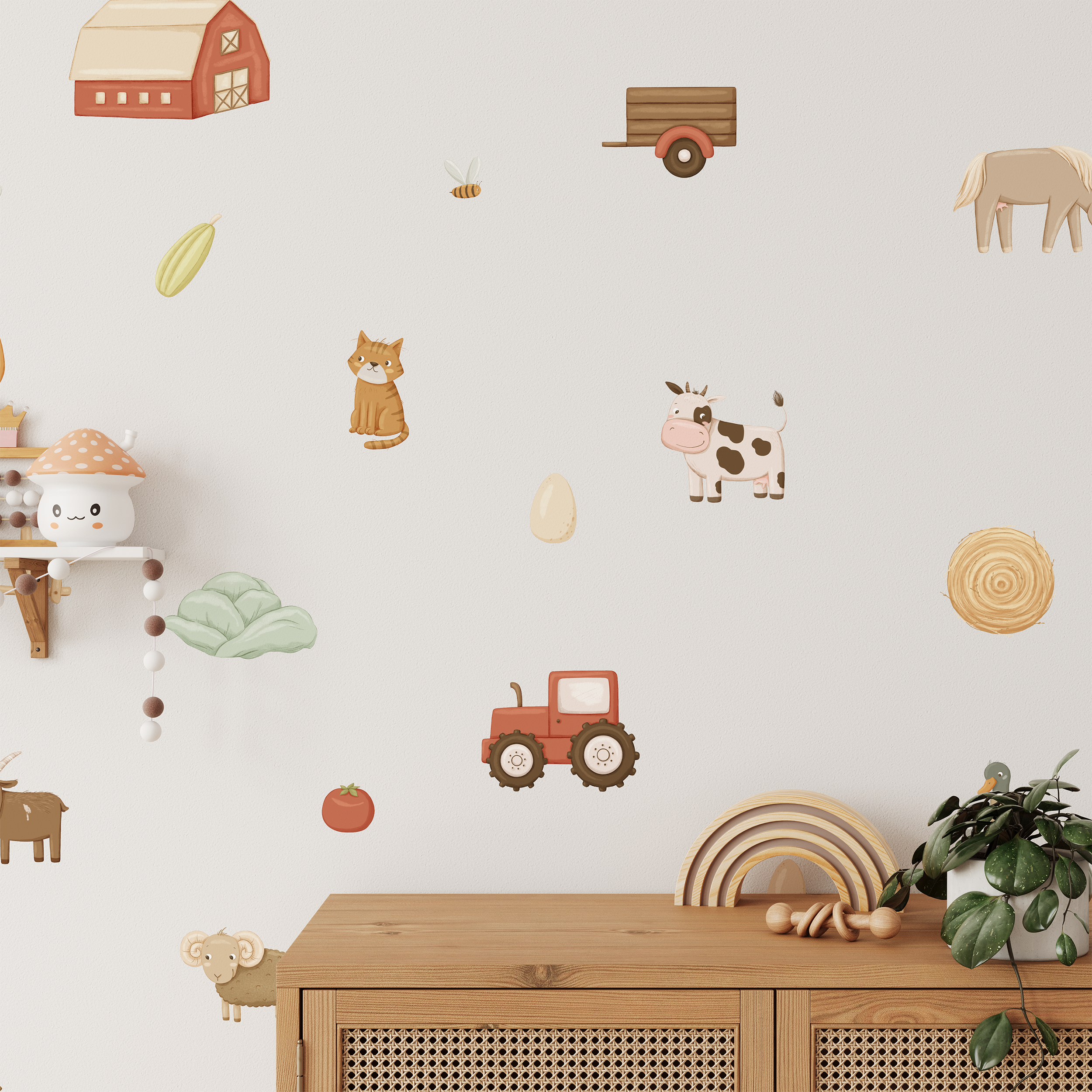 The nursery features Baby Belle's On The Farm Wall Decals, including a barn, cat, cow, horse, goat, sheep, tractor, wagon, vegetables, and hay bale. A wooden cabinet and shelf with toys and a plant finish the charming décor.