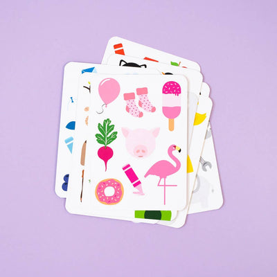 Priya & Peanut Colour Flash Cards for toddlers shown on a purple background, with the top card featuring pink items like a balloon, socks, popsicle, pig, beet, flamingo, crayon and donut—an ideal early learning tool.