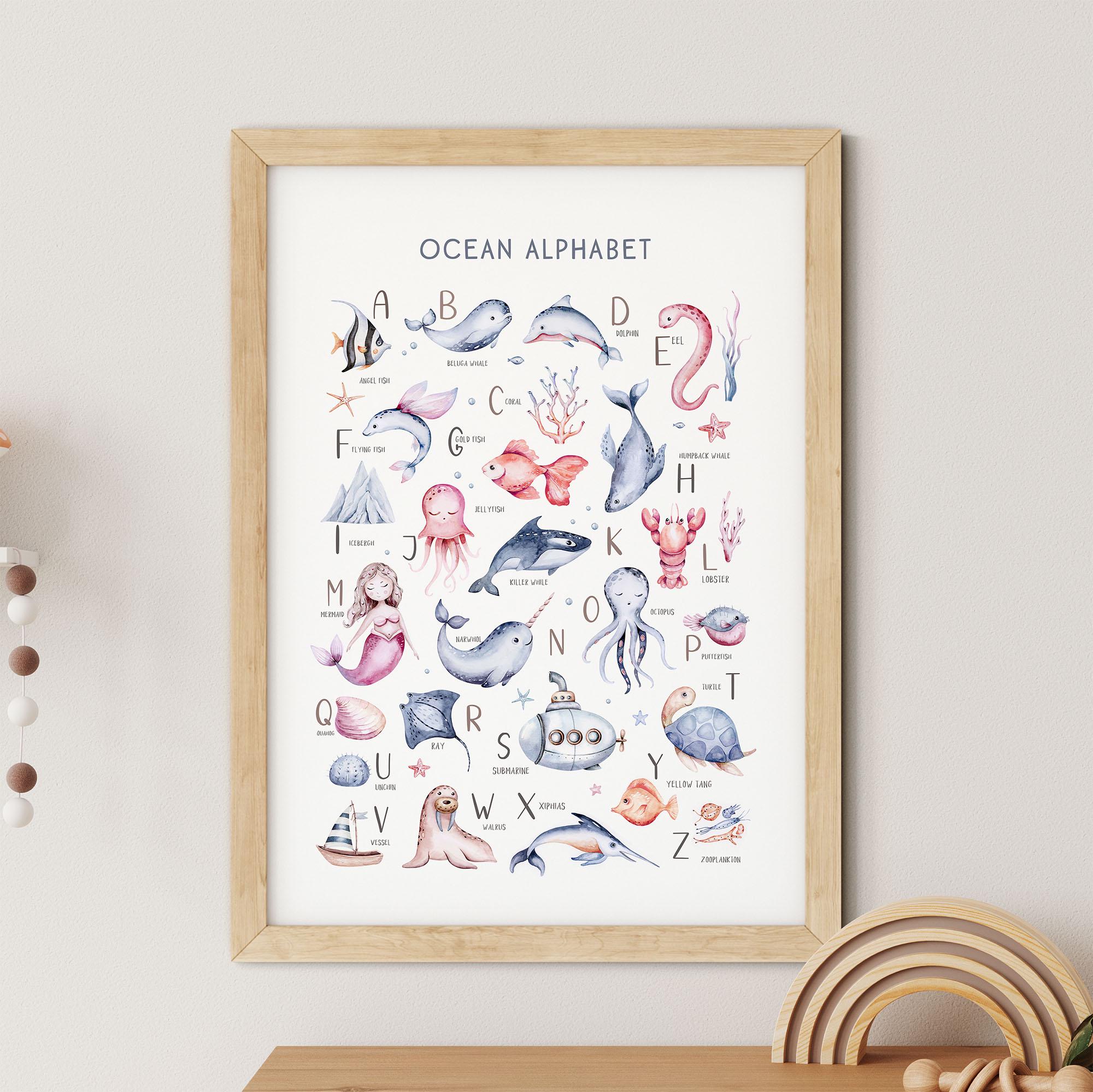 The Under The Sea Nursery Wall Print from My Store features a framed poster with an ocean-themed alphabet, illustrating marine animals like Angelfish for A and Blue Whale for B on a white background. This charming nursery art adds educational value to any childs room.