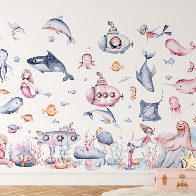 The Under The Sea Nursery Wall Stickers by My Store features a playful ocean mural with vibrant undersea-themed decals, showcasing dolphins, whales, submarines, mermaids, fish, jellyfish, crabs among coral reefs and starfish.