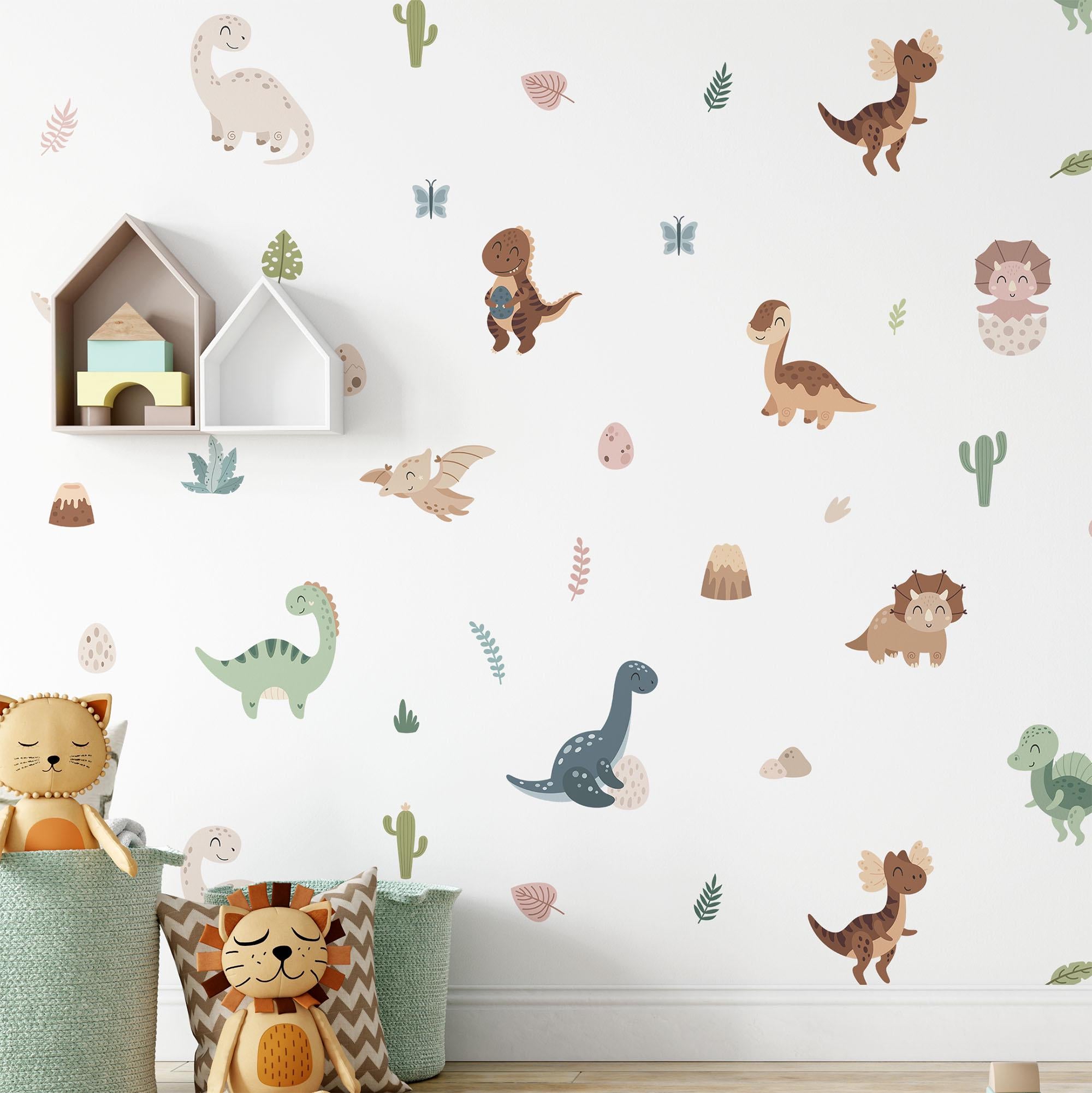 The childrens room is adorned with My Stores Fun Dinosaurs Stickers and white house-shaped shelves. A cat and a lion plush toy rest in patterned storage baskets on the floor, enhancing the colorful decor. The self-adhesive stickers make it easy to refresh the space.