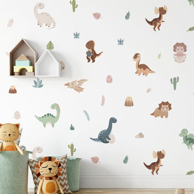 The childrens room is adorned with My Stores Fun Dinosaurs Stickers and white house-shaped shelves. A cat and a lion plush toy rest in patterned storage baskets on the floor, enhancing the colorful decor. The self-adhesive stickers make it easy to refresh the space.
