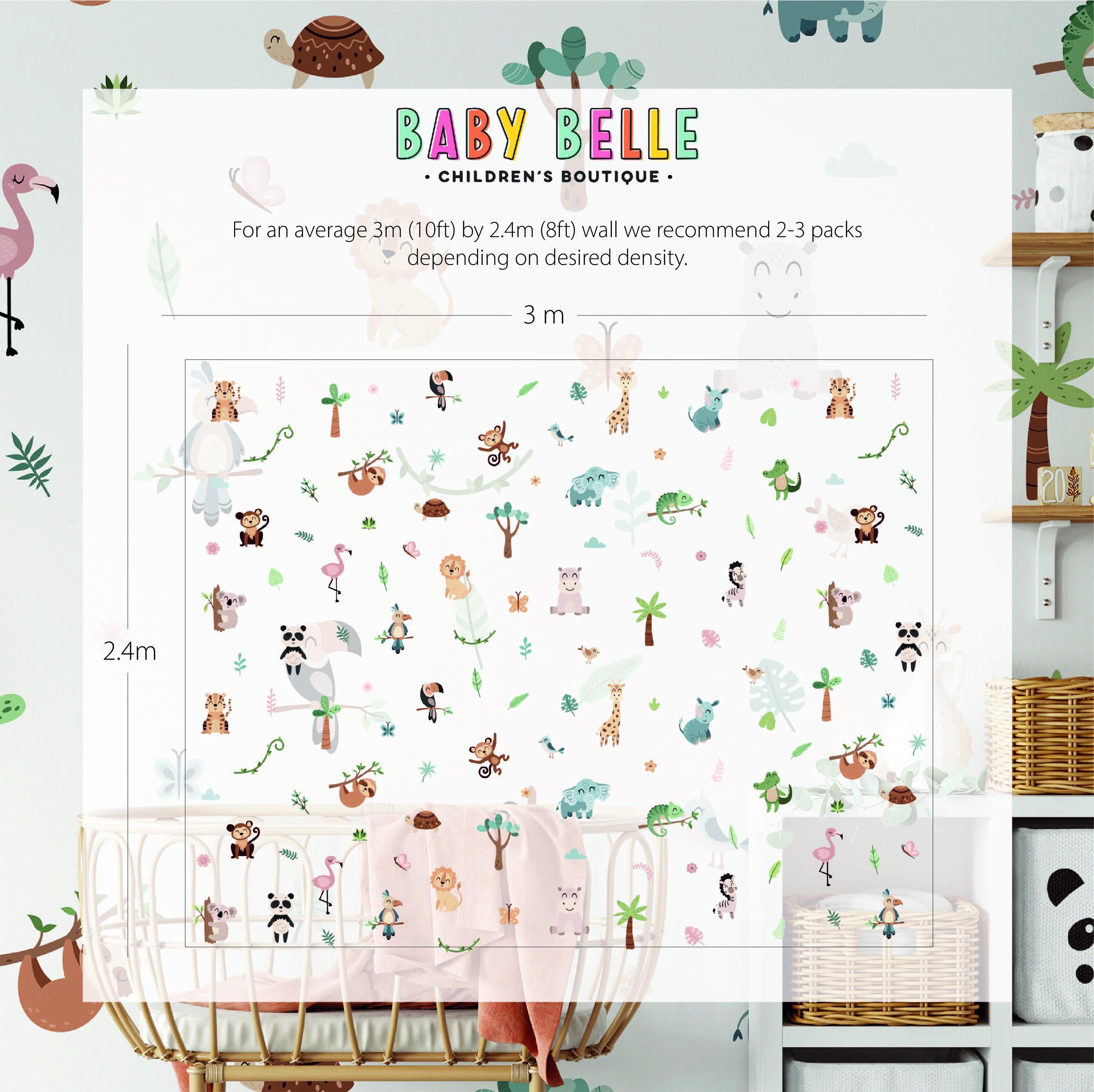 A childrens room features whimsical animal wallpaper with flamingos, pandas, and elephants on white. A crib is in the foreground beside a toy shelf. Text suggests pairing the wallpaper with My Stores Jungle Animal Wall Stickers for charming nursery decor.