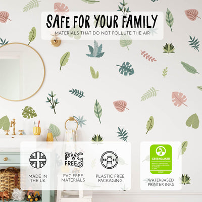 A room with a My Store white dresser and Tropical Leaves Nursery Wall Stickers on the wall. A mirror hangs above, and text at the top declares Safe for your family, highlighting eco-friendly materials and packaging.