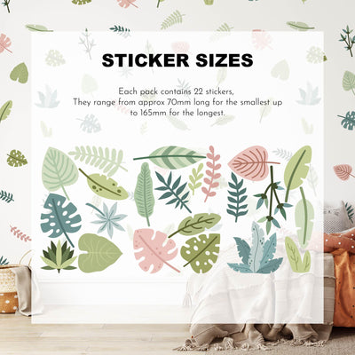 Tropical Leaves Nursery Wall Stickers by My Store are displayed on a white background labeled Sticker Sizes, with a cozy room featuring cushions below to highlight their versatile use.