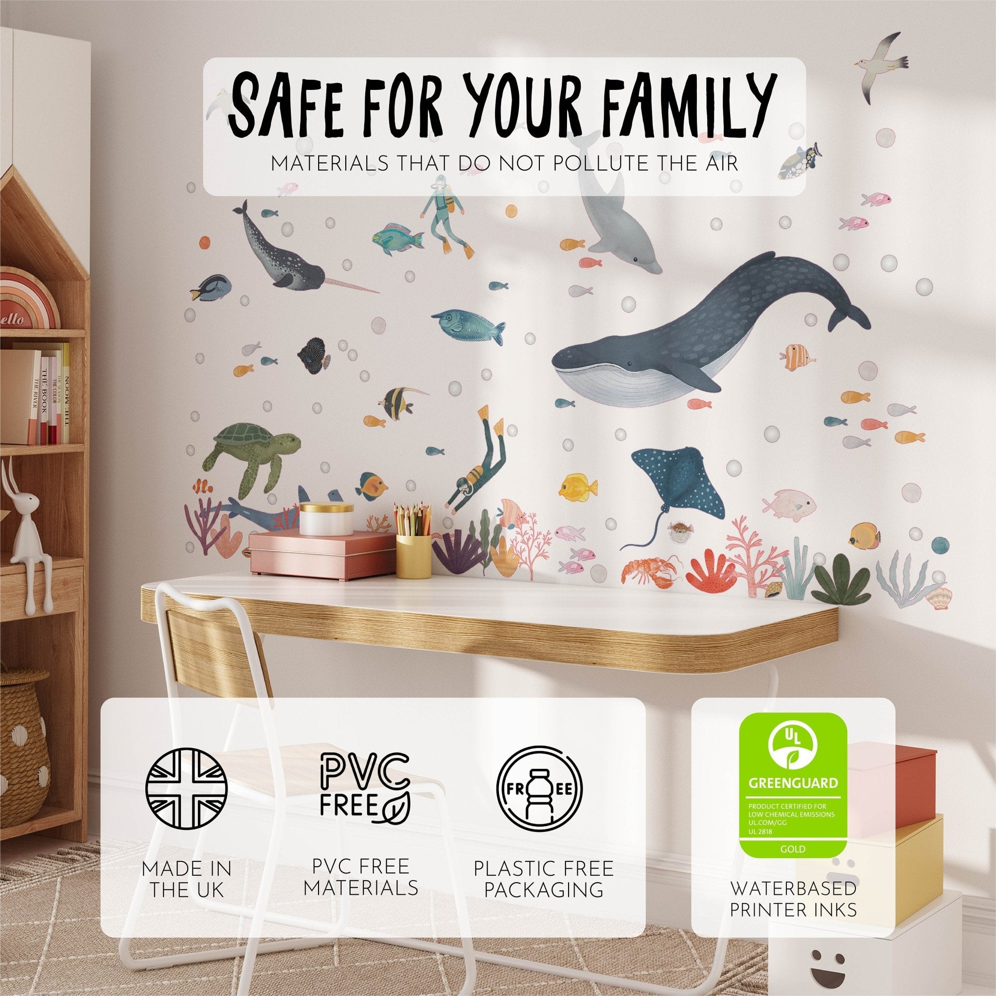 A childrens room showcases My Stores Sea Animals Stickers featuring whales and fish. A nearby wooden desk and shelf are filled with toys, all labeled eco-friendly: PVC-free, plastic-free packaging, water-based inks, and crafted in the UK.