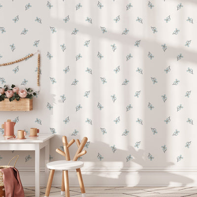 A childs room features Summer Mood Wall Stickers from My Store, a small white table with a chair, wooden toys, and a basket of flowers. Wooden bead art adds charm, while soft sunlight filters in, casting gentle shadows.