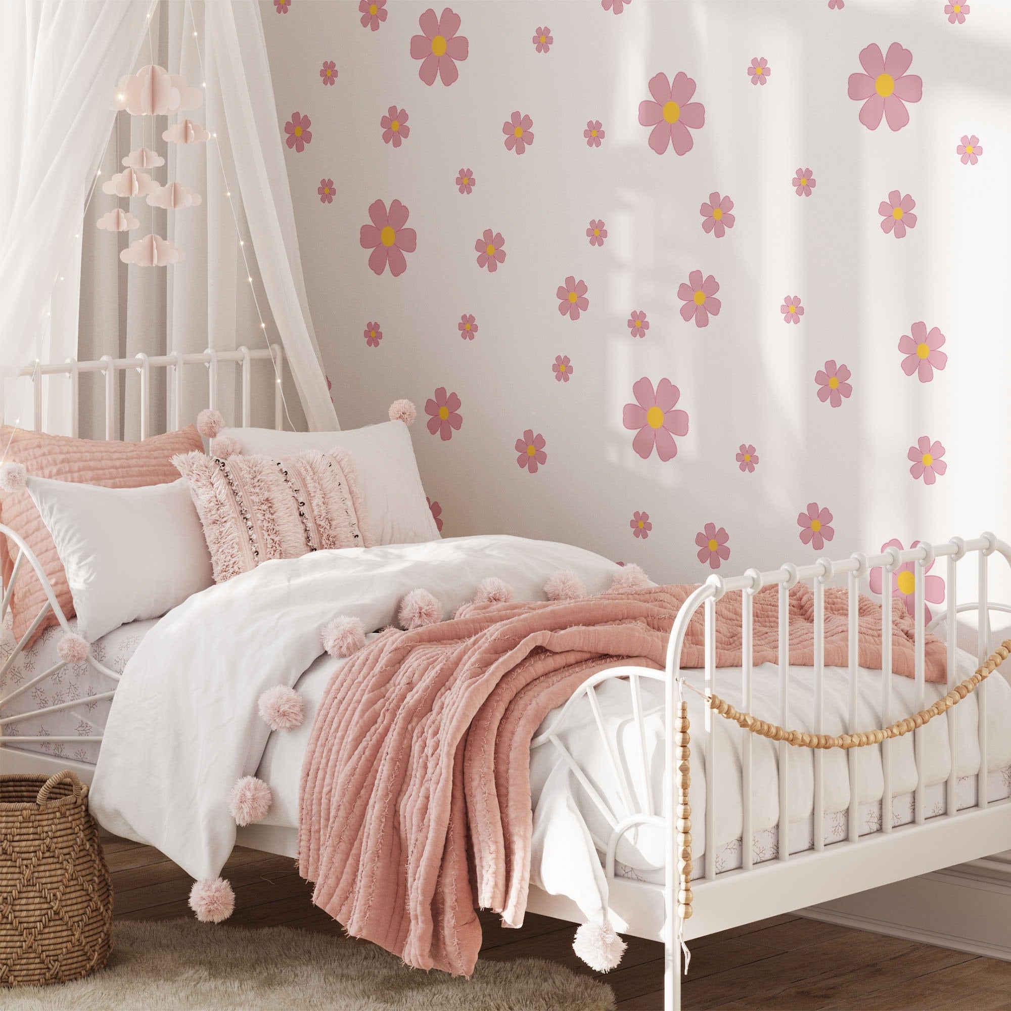 A bed with pink pillows and a white frame sits beneath My Store's Pink Daisy Floral Wall Decals, adding a playful touch to the room.